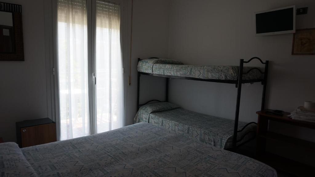 Postel nebo postele na pokoji v ubytování Hotel Daria