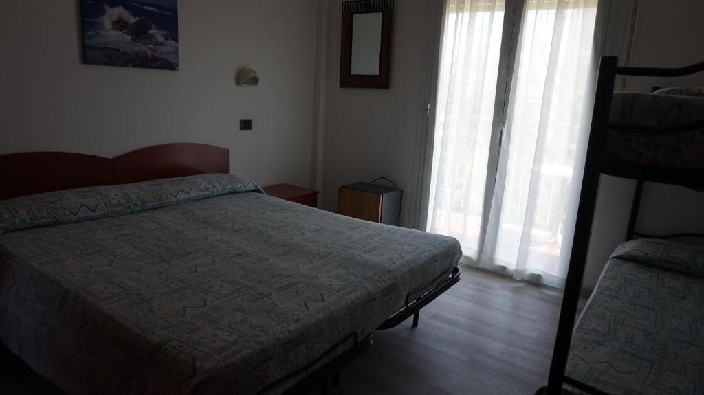 Postel nebo postele na pokoji v ubytování Hotel Daria
