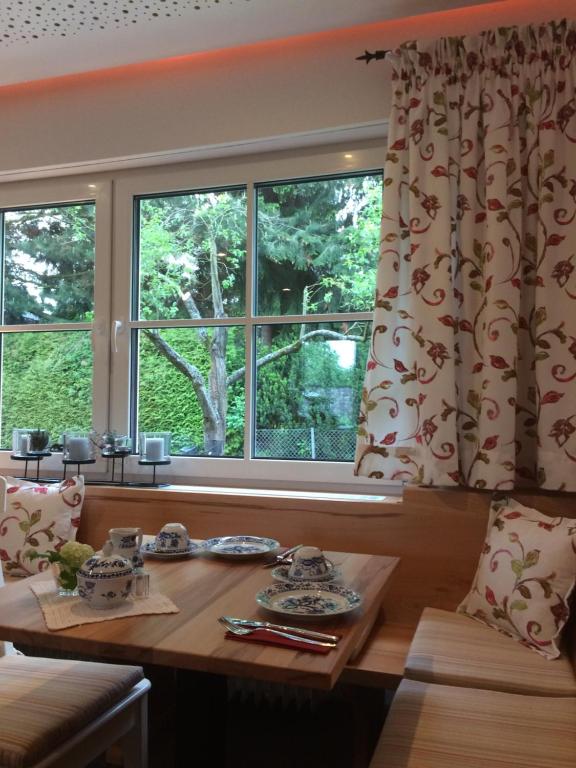 a dining room with a table and a window at Mansion in Bad Arolsen