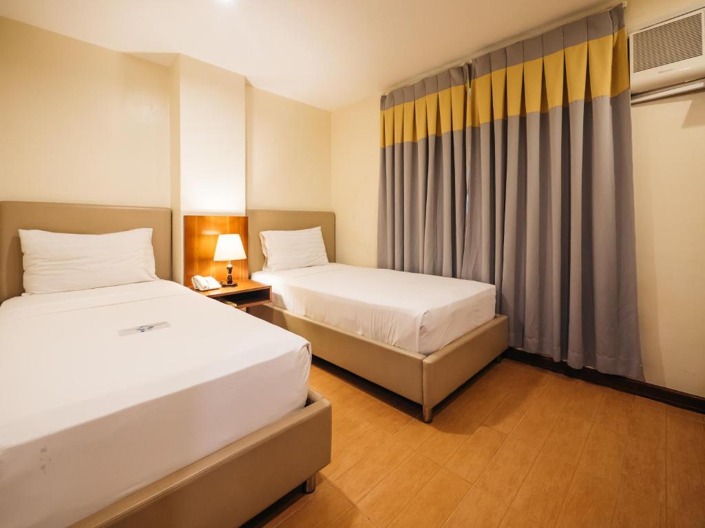 Postel nebo postele na pokoji v ubytování The Well Hotel
