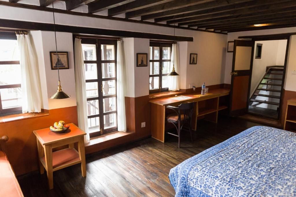 Postel nebo postele na pokoji v ubytování Milla Guesthouse Bhaktapur