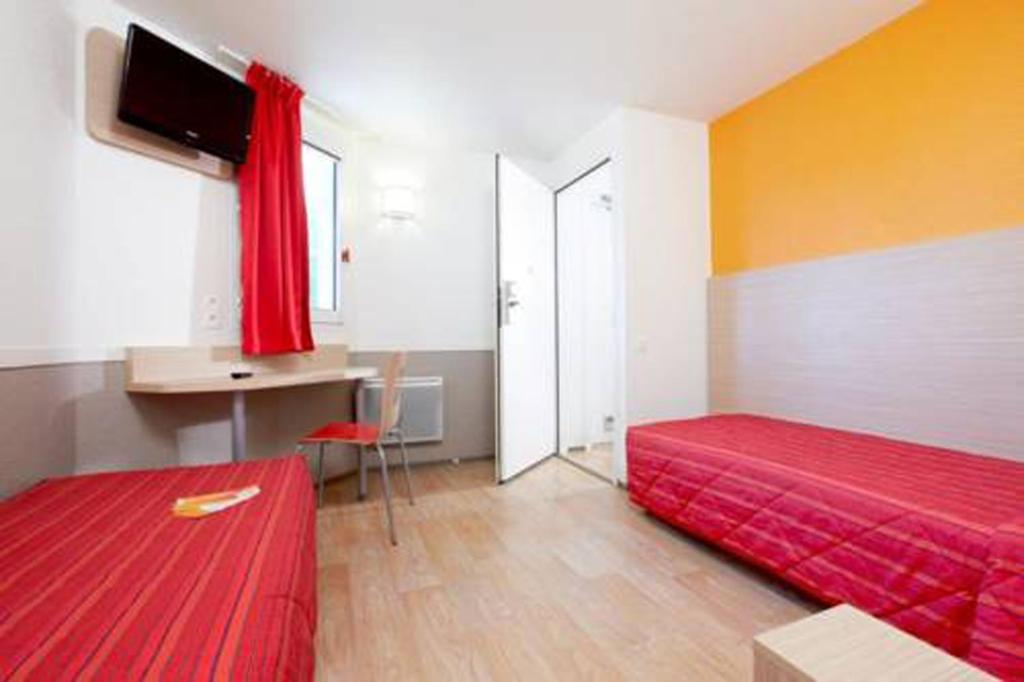 Postel nebo postele na pokoji v ubytování Hotel HECO Lyon sud Vienne