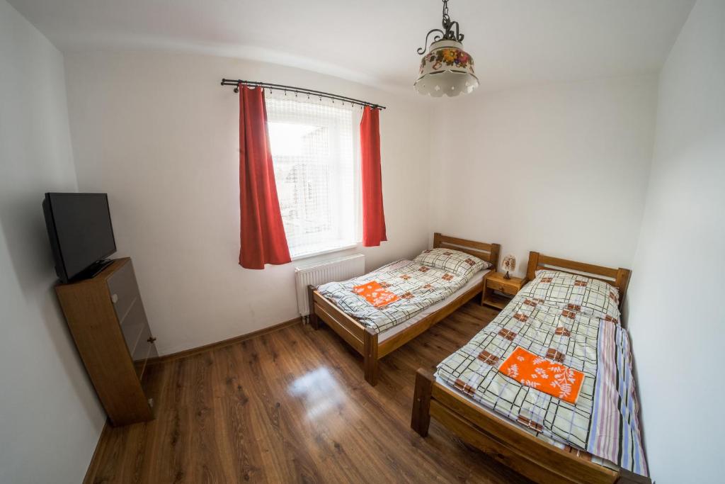 Postel nebo postele na pokoji v ubytování Stovka Božanov