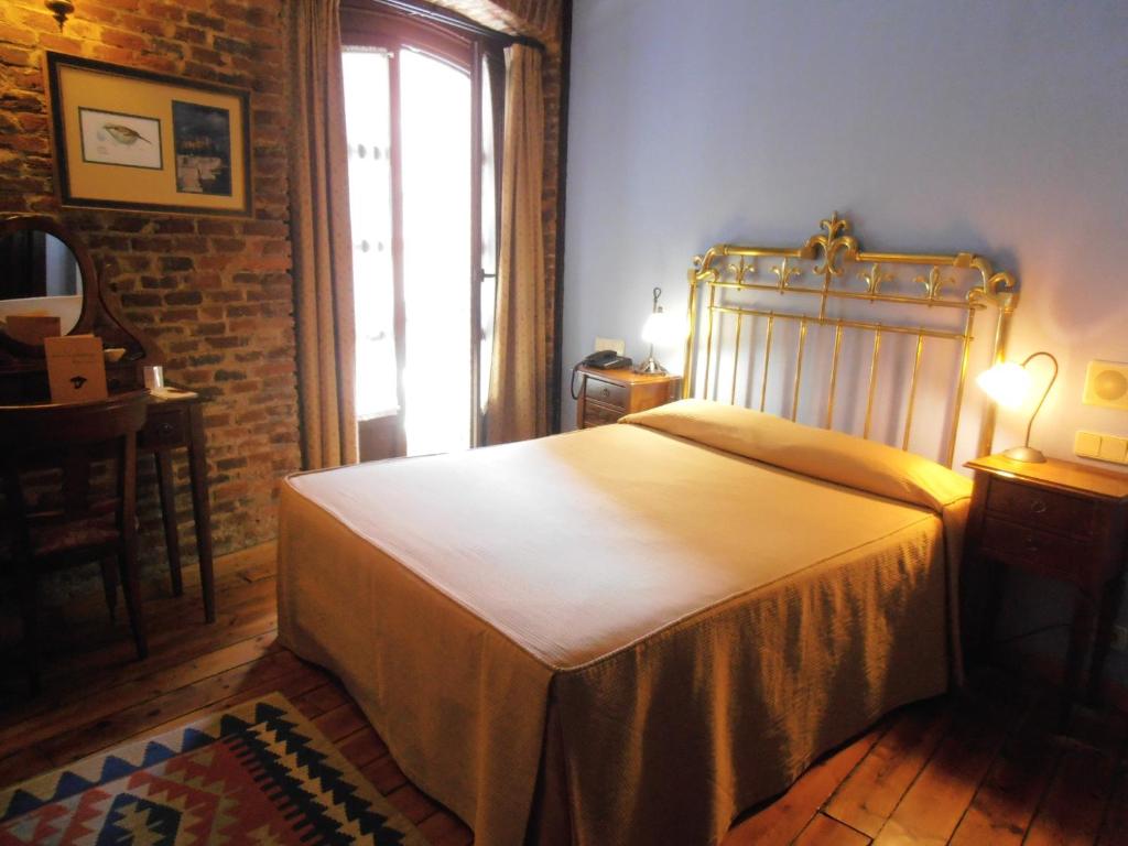 Postel nebo postele na pokoji v ubytování Hotel La Posada Regia