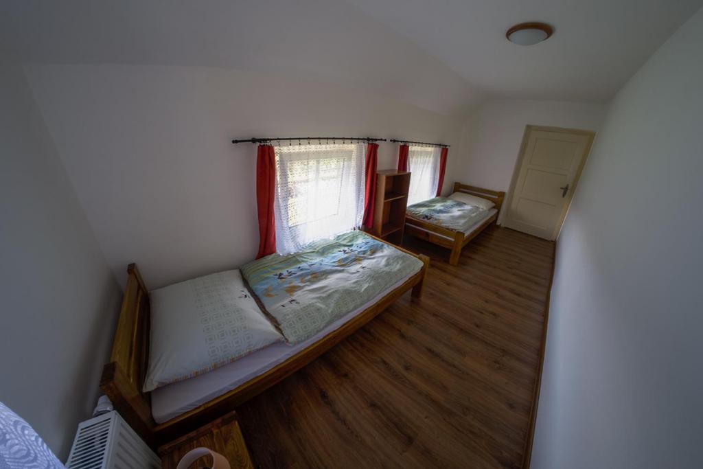 Postel nebo postele na pokoji v ubytování Stovka Božanov