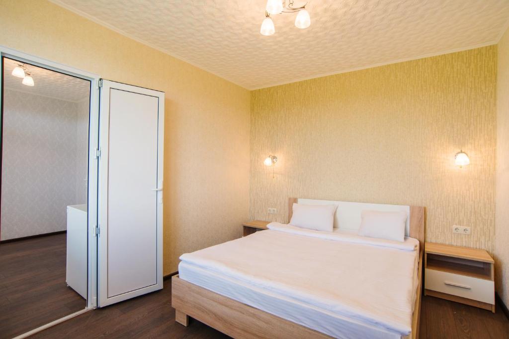 Postel nebo postele na pokoji v ubytování Guest House Filin