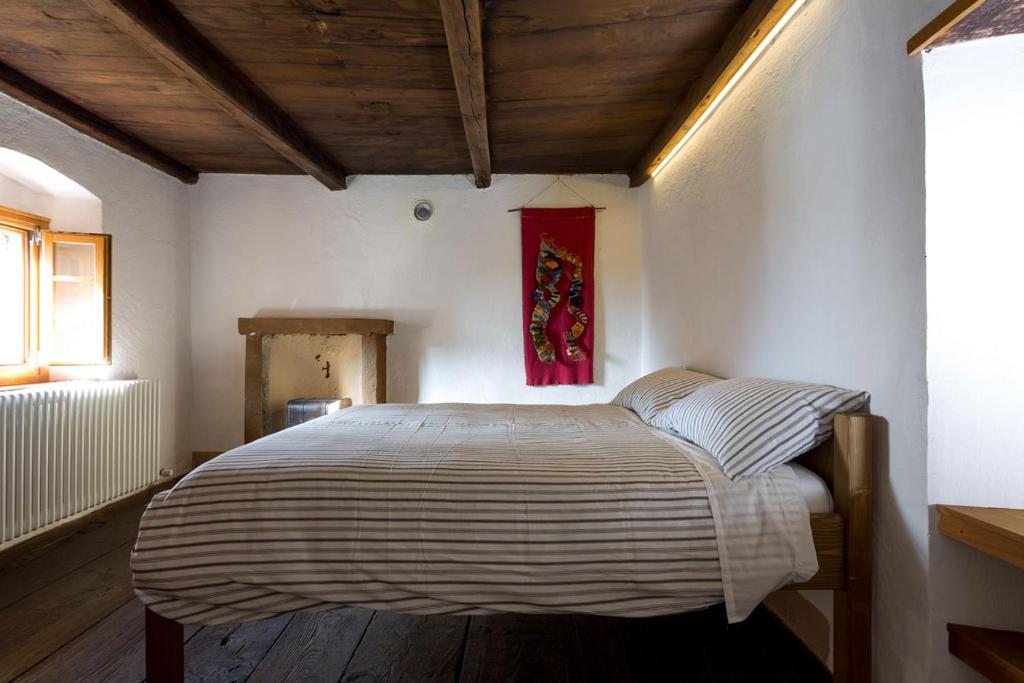 Postel nebo postele na pokoji v ubytování Rifugio Uschione