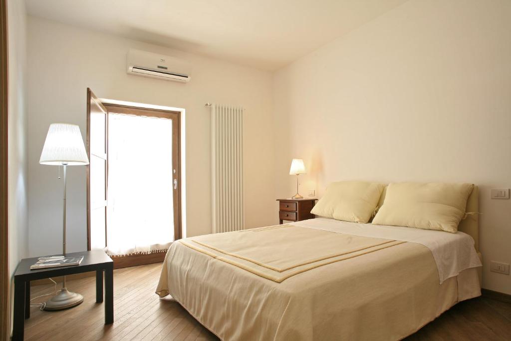 Łóżko lub łóżka w pokoju w obiekcie Grotta Cilicia B&B