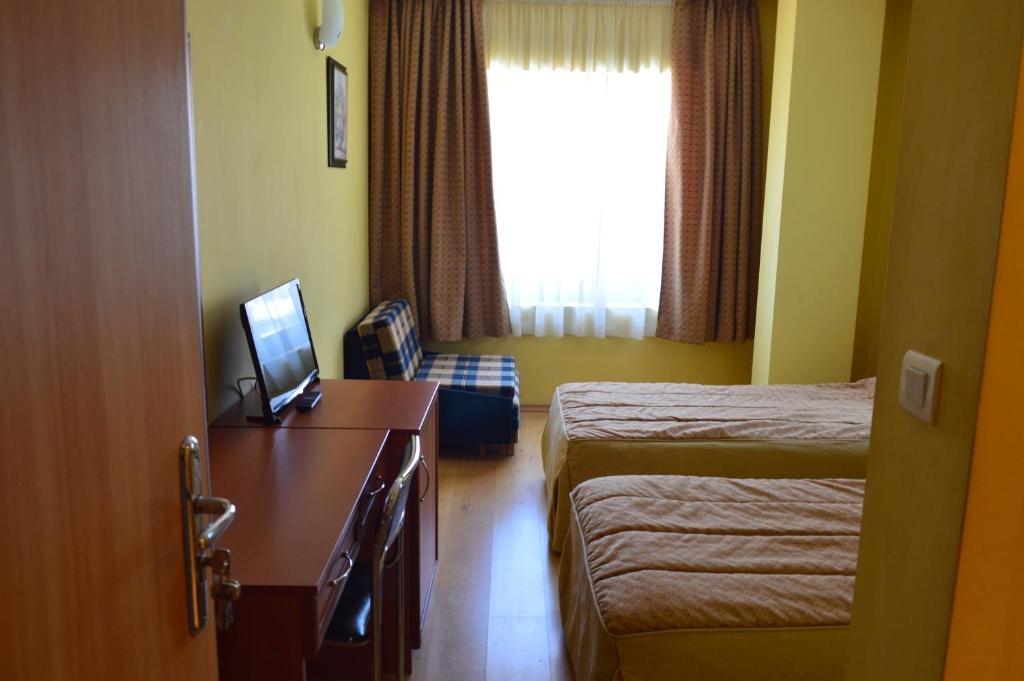Postel nebo postele na pokoji v ubytování Stankoff Hotel