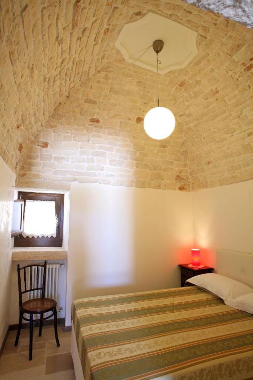 Łóżko lub łóżka w pokoju w obiekcie Grotta Cilicia B&B