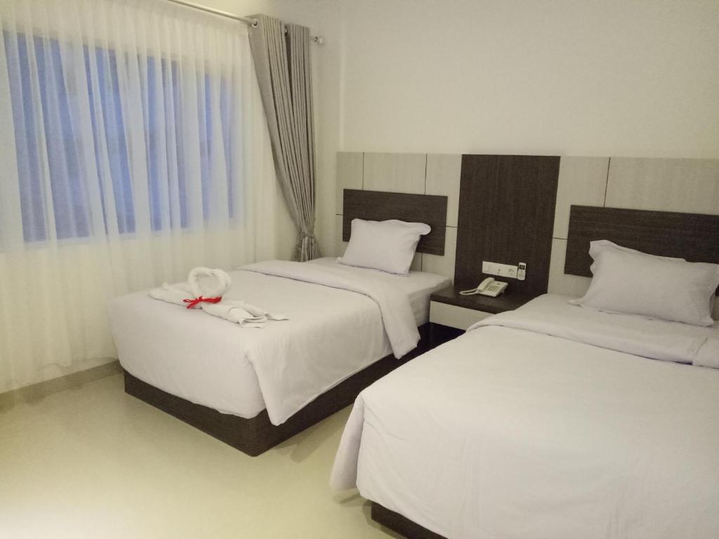 Postel nebo postele na pokoji v ubytování Seventeen Hotel
