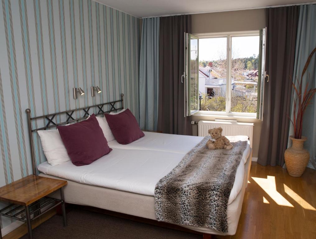 Postel nebo postele na pokoji v ubytování Maude´s Hotel Enskede Stockholm