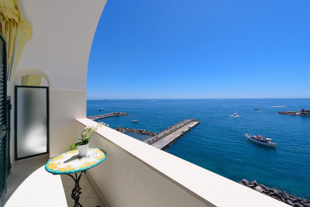 a balcony with a view of the ocean at Vista d'Amalfi in Amalfi