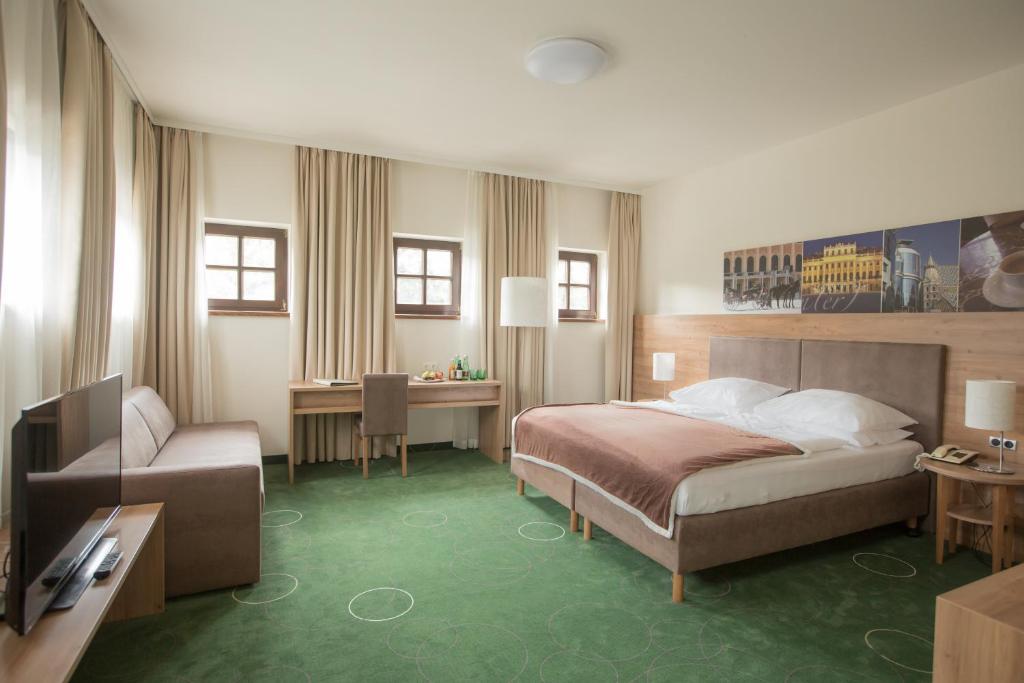 Postel nebo postele na pokoji v ubytování Seminarhotel Lengbachhof GmbH