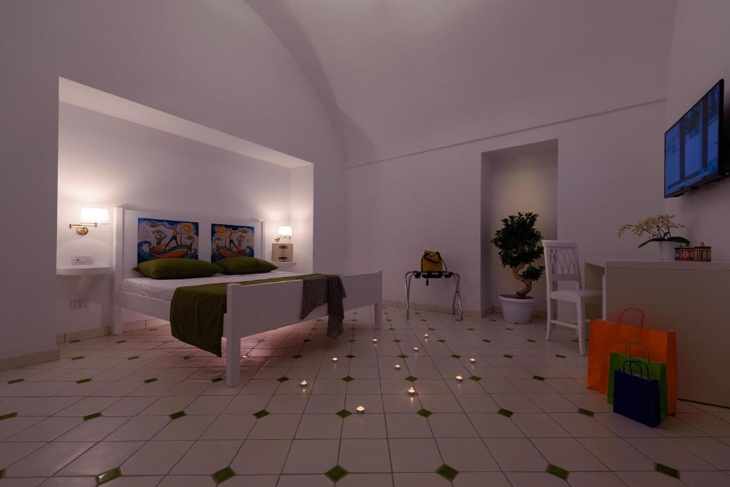 a bedroom with a bed in a room with stars on the floor at Vista d'Amalfi in Amalfi