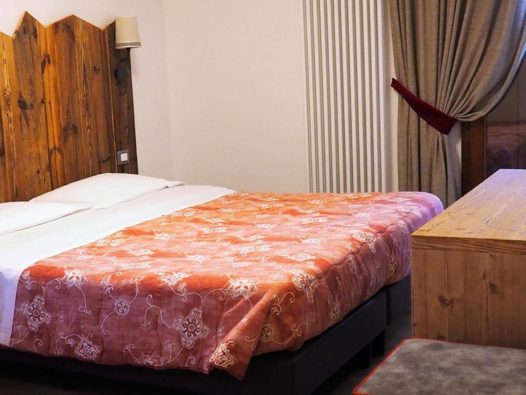 Postel nebo postele na pokoji v ubytování Hotel Serena