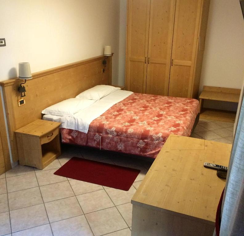 Postel nebo postele na pokoji v ubytování Hotel Serena