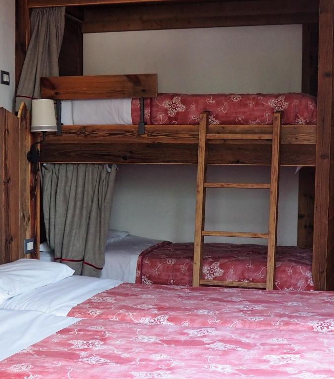 Postel nebo postele na pokoji v ubytování Hotel Serena