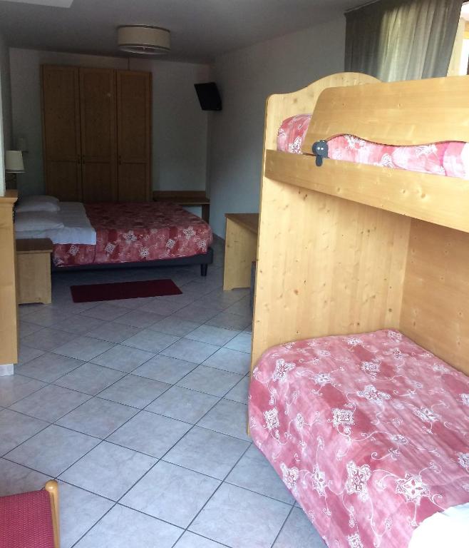 Postel nebo postele na pokoji v ubytování Hotel Serena