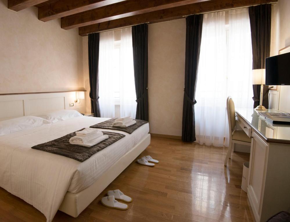 Postel nebo postele na pokoji v ubytování Albergo Mazzanti