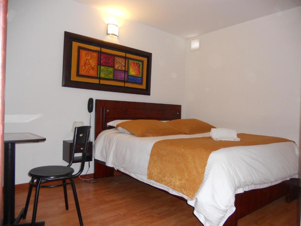 Postel nebo postele na pokoji v ubytování Hotel Expo Inn Embajada