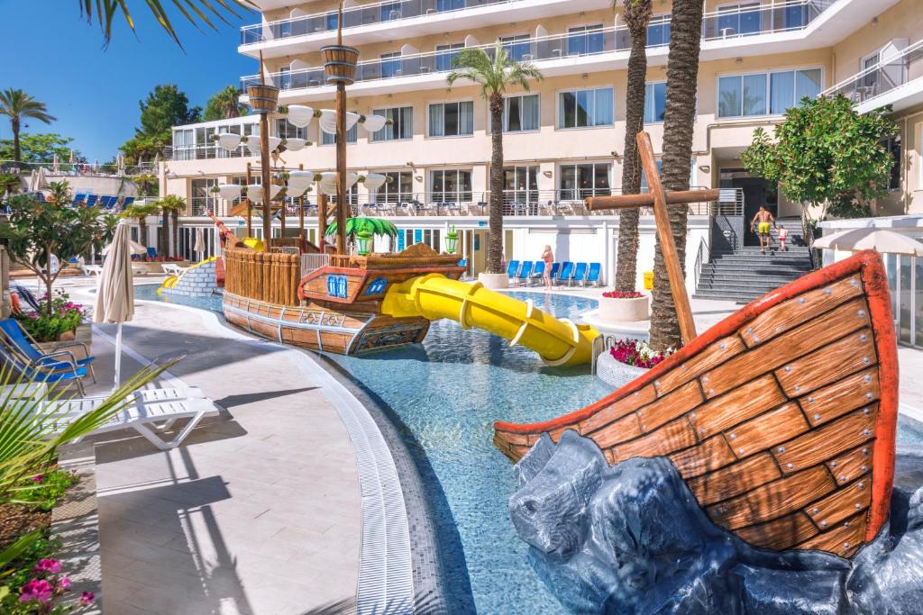 a water slide at a resort with a water park at Hotel Oasis Park Splash in Calella