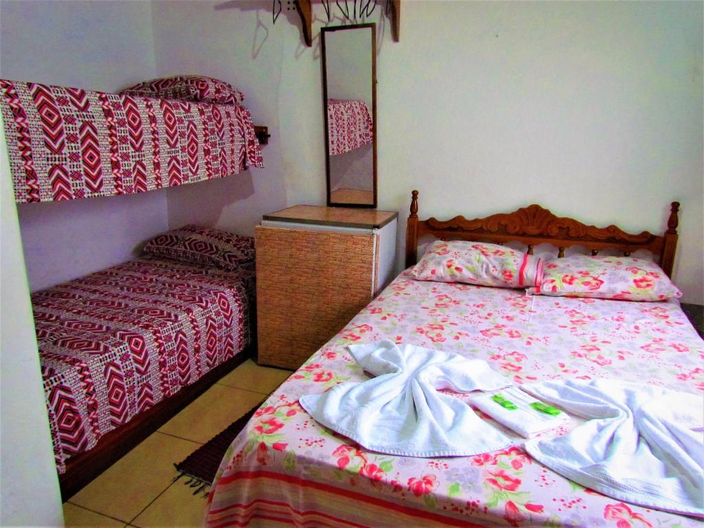 Postel nebo postele na pokoji v ubytování Aracy Paraty