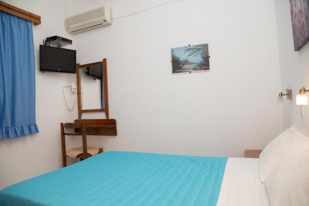 A bed or beds in a room at Perigiali