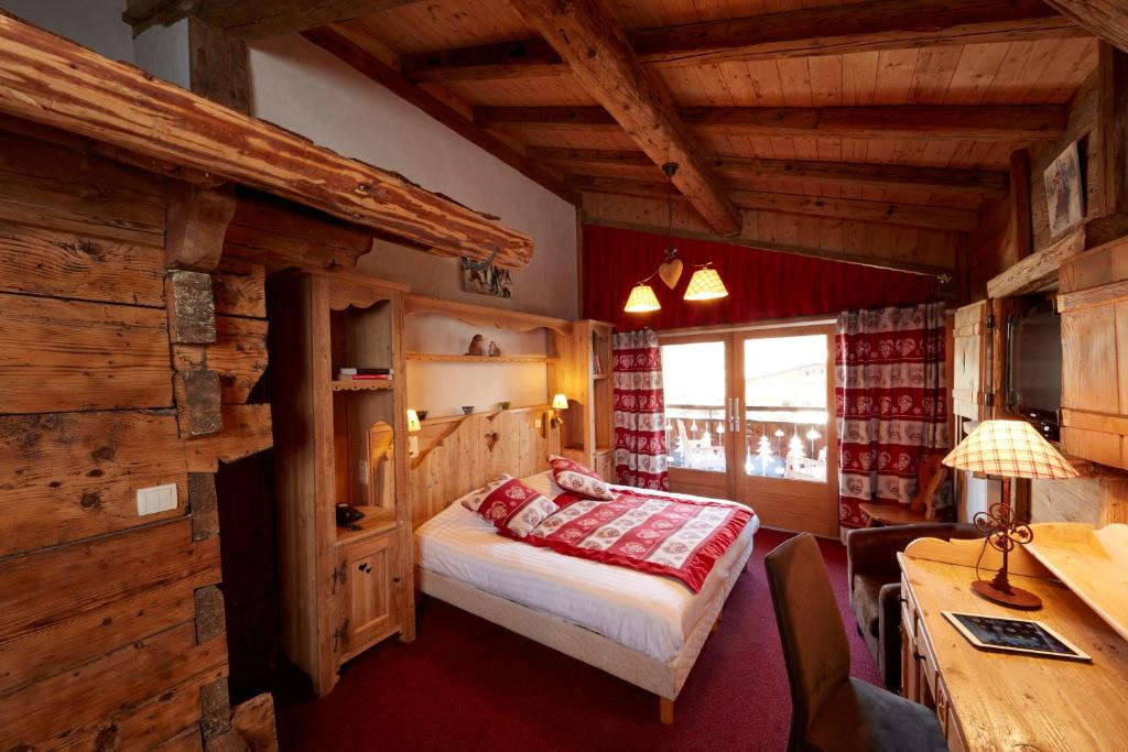 Postel nebo postele na pokoji v ubytování Hotel L'Equipe