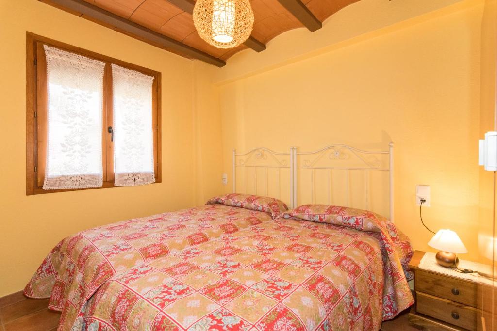 A bed or beds in a room at Casa Las Eras