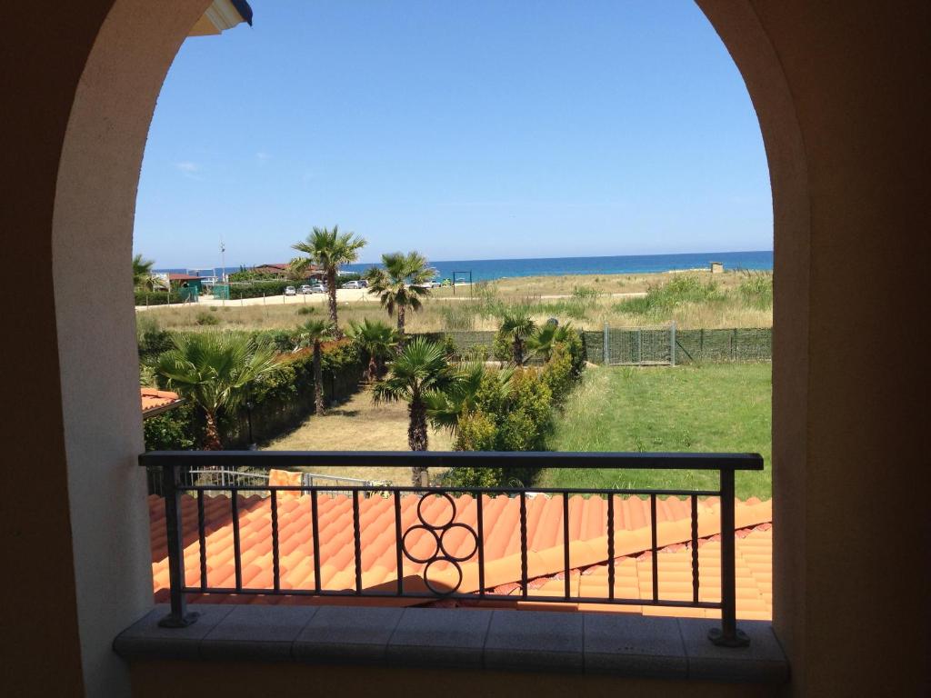 a view of the beach from a balcony at Pizzo Marinella in Pizzo