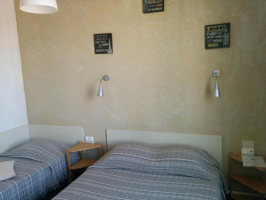Postel nebo postele na pokoji v ubytování Hotel Araur