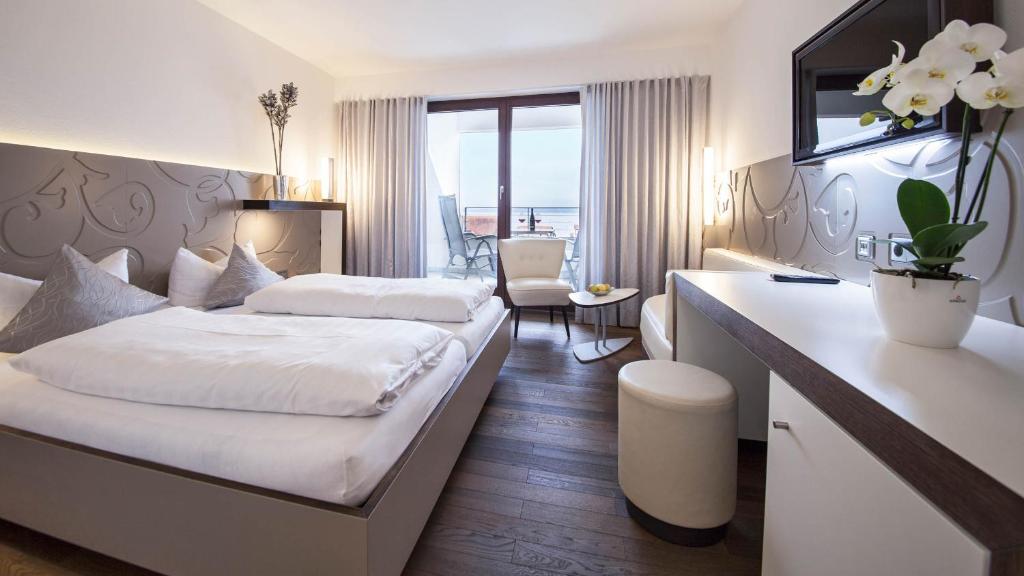 Postel nebo postele na pokoji v ubytování Hotel Restaurant Hansjakob