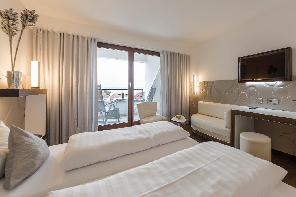 Postel nebo postele na pokoji v ubytování Hotel Restaurant Hansjakob