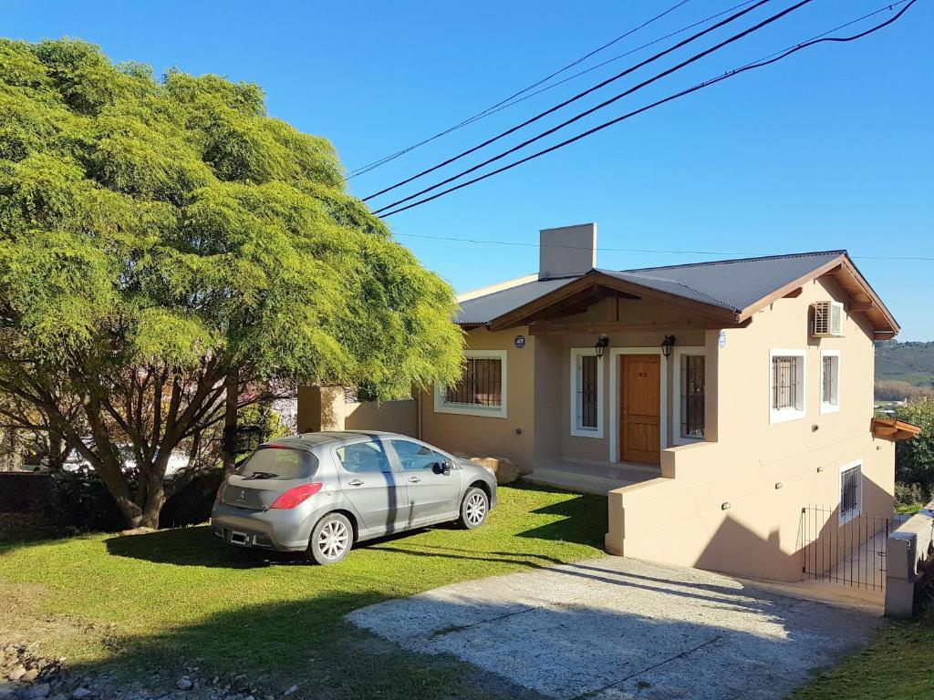 a car parked in front of a house at Cabañas Piedras de Tandil in Tandil