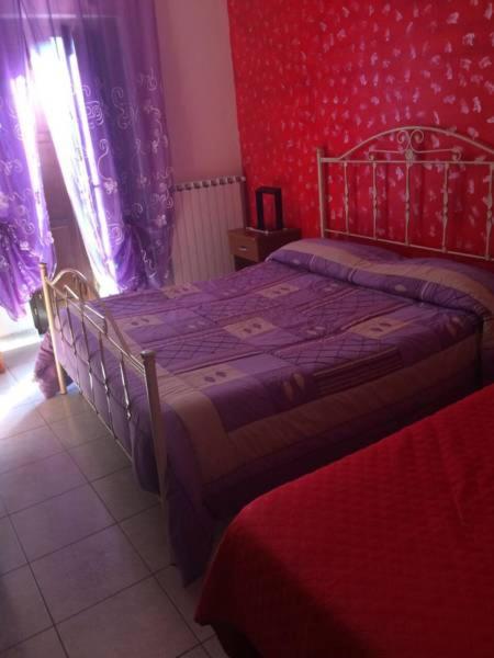 Postel nebo postele na pokoji v ubytování B&B Al Castello