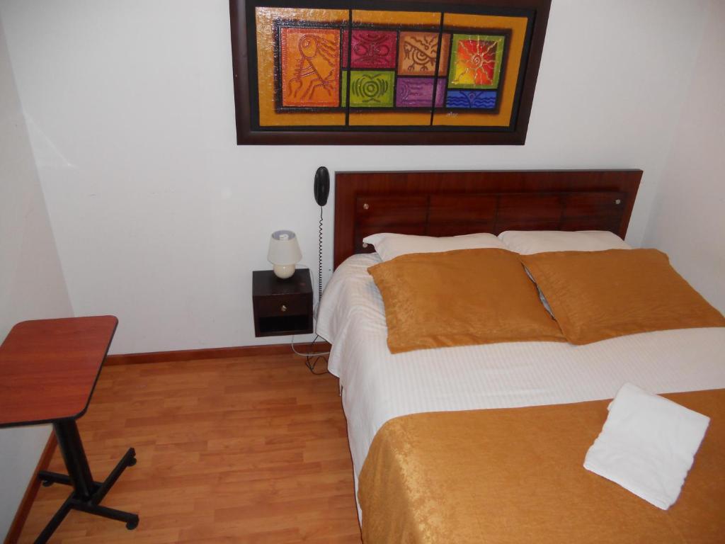 Postel nebo postele na pokoji v ubytování Hotel Expo Inn Embajada