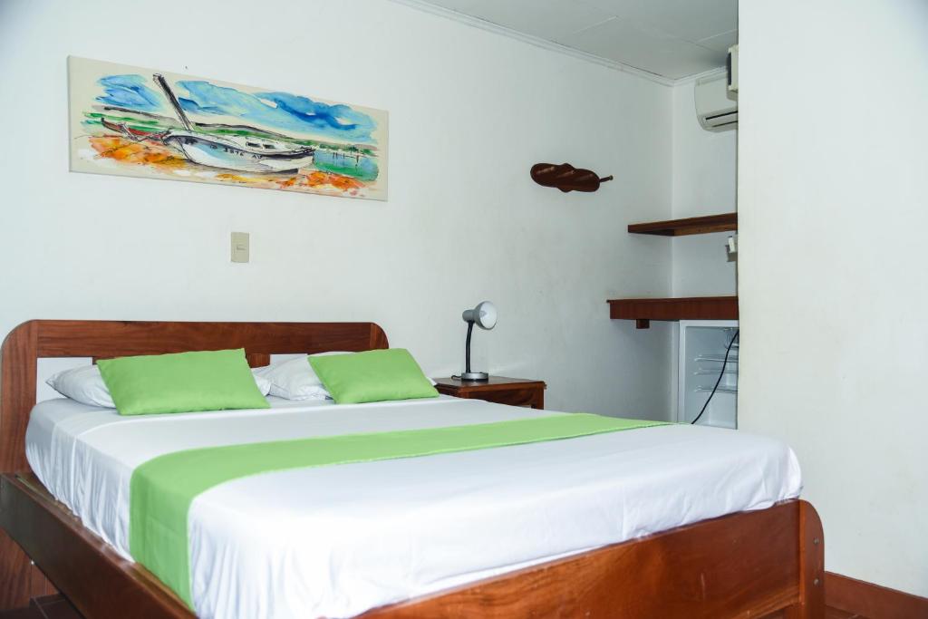 Postel nebo postele na pokoji v ubytování Hotel Marielos