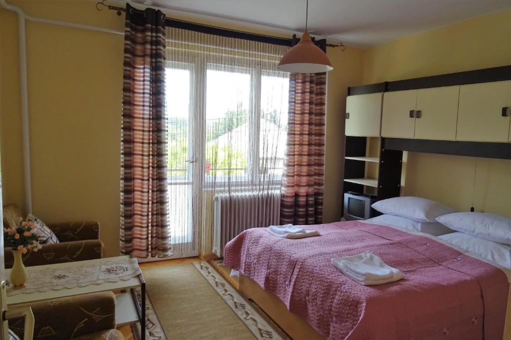 Postel nebo postele na pokoji v ubytování Altan Apartments