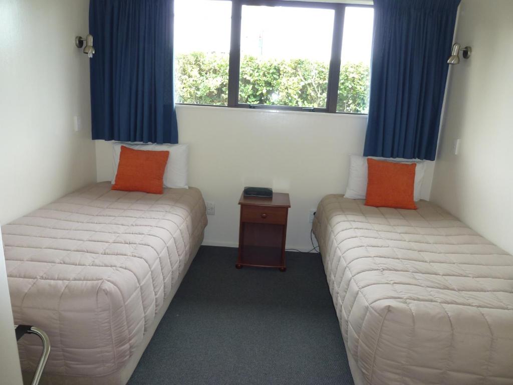 Postel nebo postele na pokoji v ubytování ASURE Adcroft Motel
