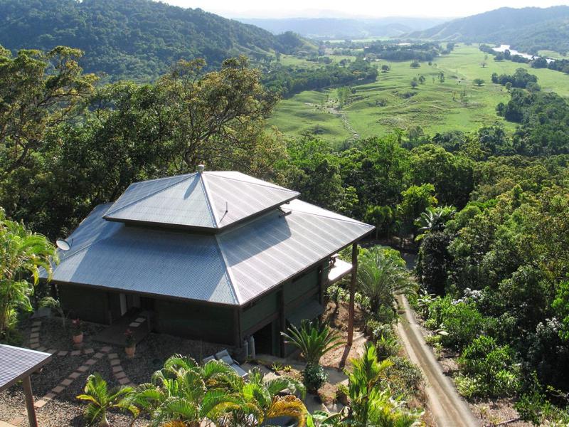 a building with an umbrella on top of a hill at Cloud 9 in Daintree