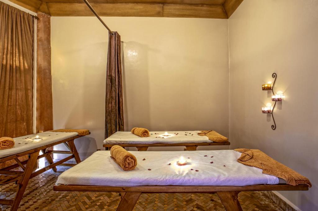 Postel nebo postele na pokoji v ubytování Hotel Kasbah Le Mirage & Spa