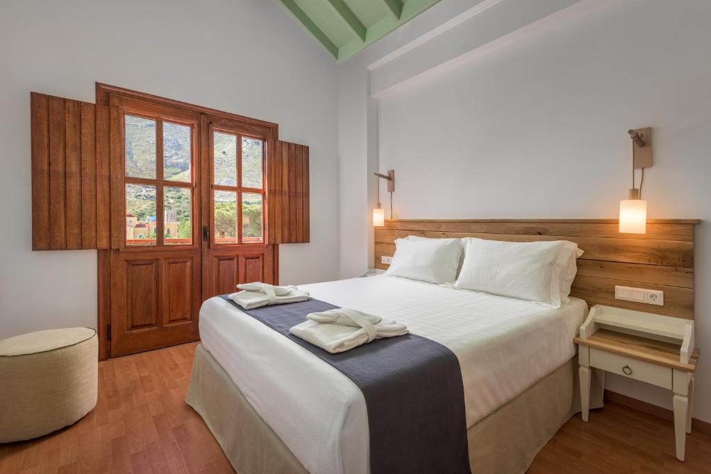 Postel nebo postele na pokoji v ubytování Asymi Residences