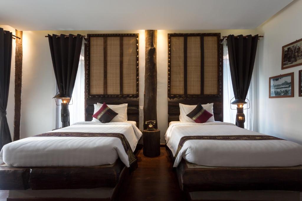 Postel nebo postele na pokoji v ubytování Khmer Paradise Villa