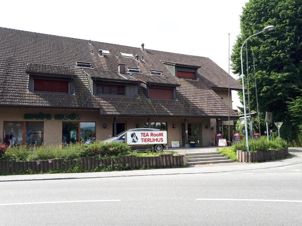 a building with a sign on the side of a street at good bed Aarwangen in Aarwangen