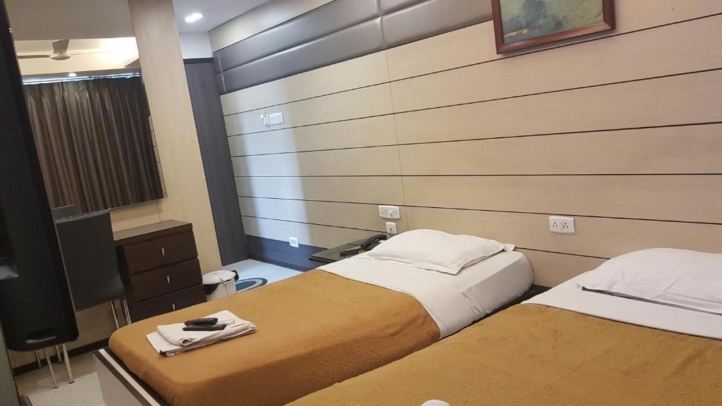 Postel nebo postele na pokoji v ubytování Hotel Esteem