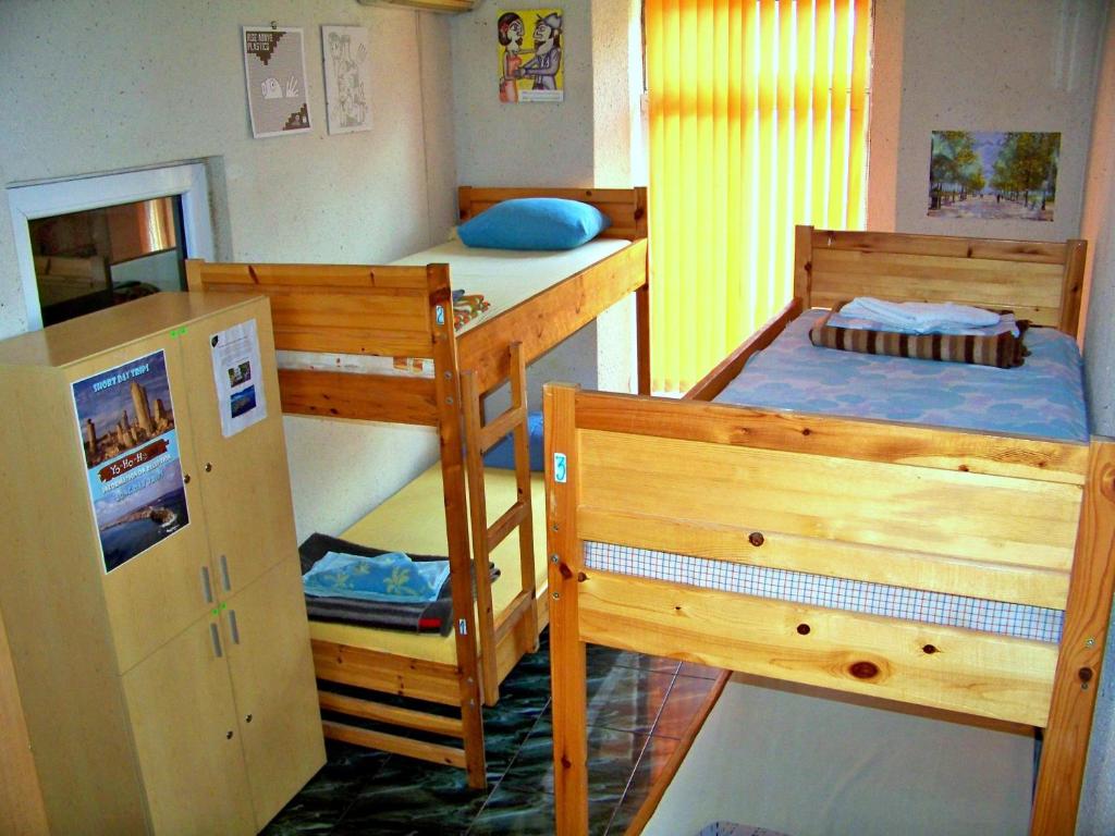Postel nebo postele na pokoji v ubytování Yo Ho Hostel