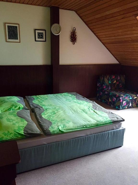 Postel nebo postele na pokoji v ubytování Tahiti Vendégpark