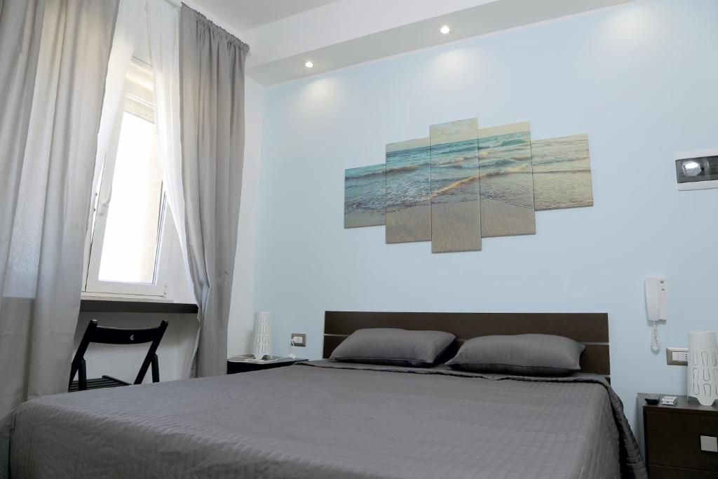 Ліжко або ліжка в номері Rooms La Perla Del Mare