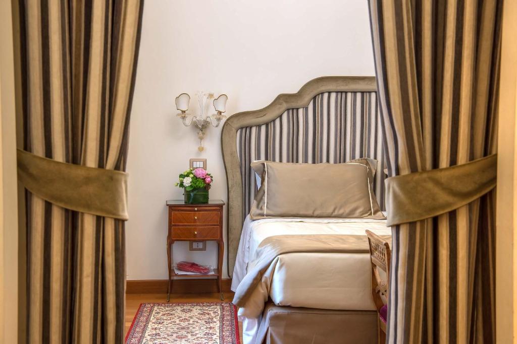 Postel nebo postele na pokoji v ubytování Hotel Forum